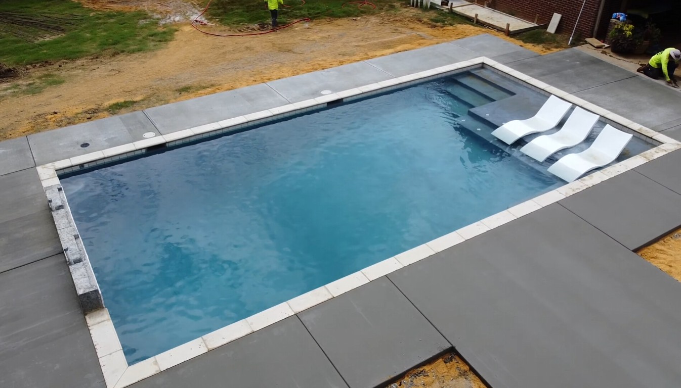 Level concrete pool deck surrounding swimming pool in Town n Country, FL